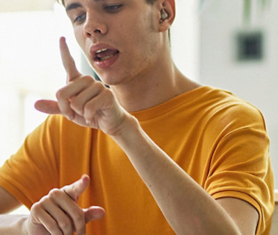 A boy looking at his fingers