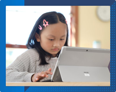 A young child using a tablet.